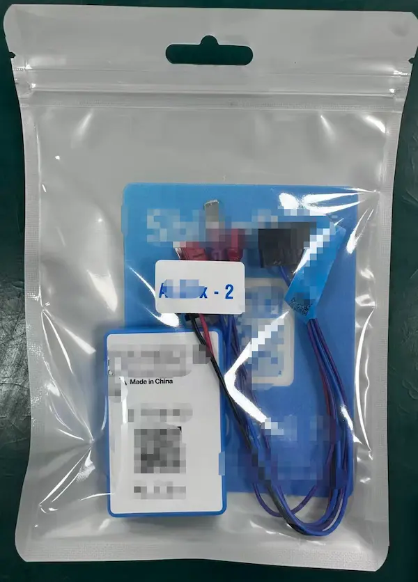 Completed fixed wireless payment terminal showing UV-resistant QR label, custom wire harness integration, and acrylic conformal coating on PCB assembly