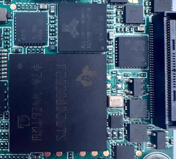 Partial Top-side view of a dense 400V 2kW motor controller prototype PCB with BGA, QFN, fine-pitch connectors, and 0201 components.