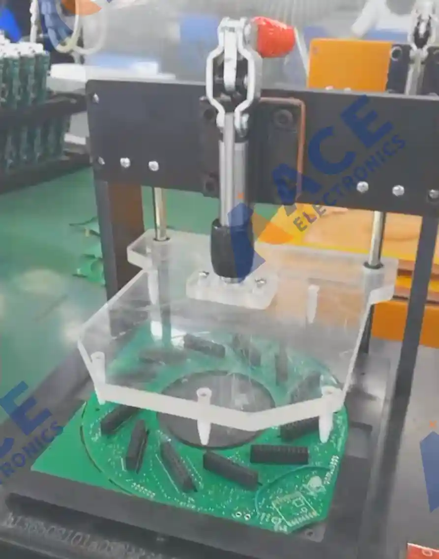 Main PCB board undergoing functional testing on a custom-built test fixture at ACE Electronics