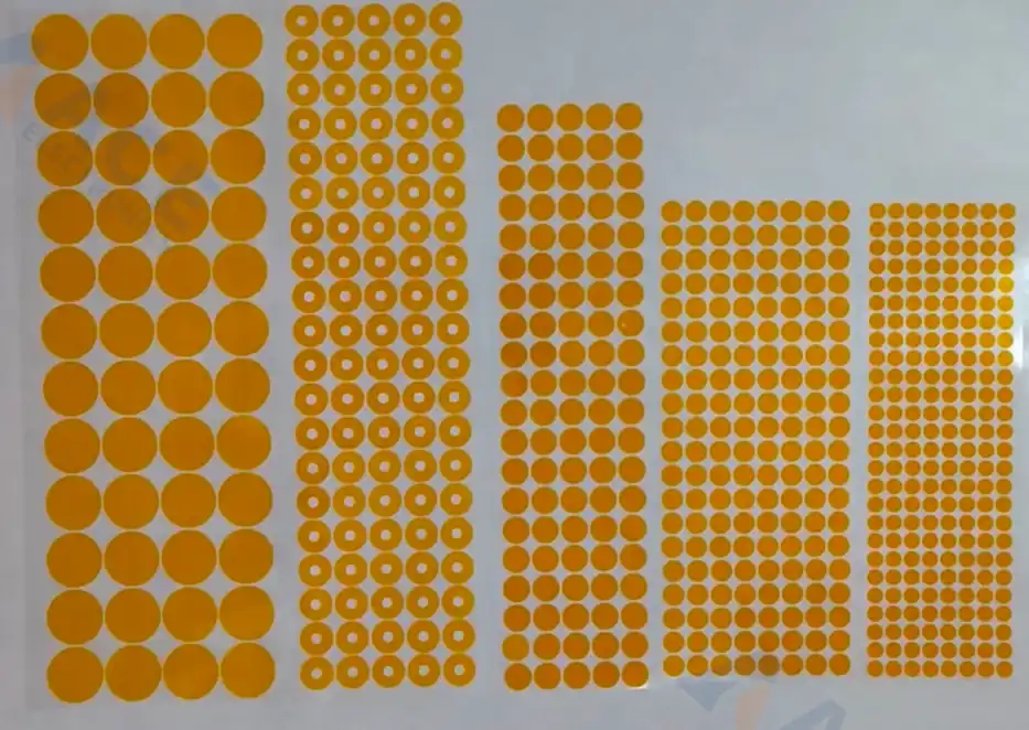 Masking dots protecting small PCB pads before conformal coating