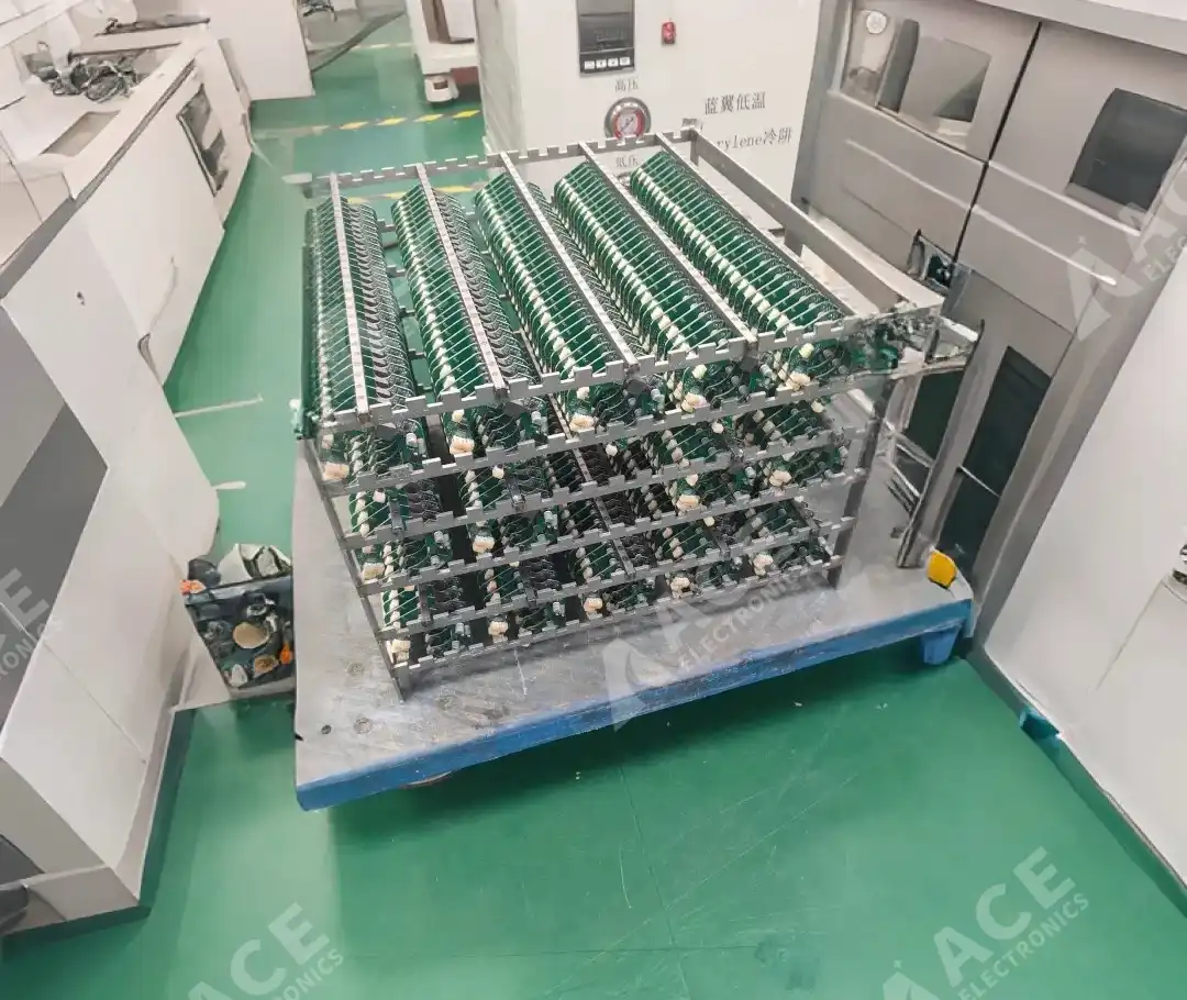 BLDC motor PCB assemblies loaded on hanger fixtures before parylene coating