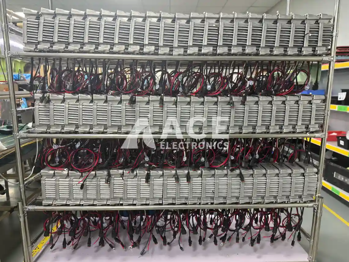 Assembled energy storage equipment units organized on a rack before finished-unit aging test