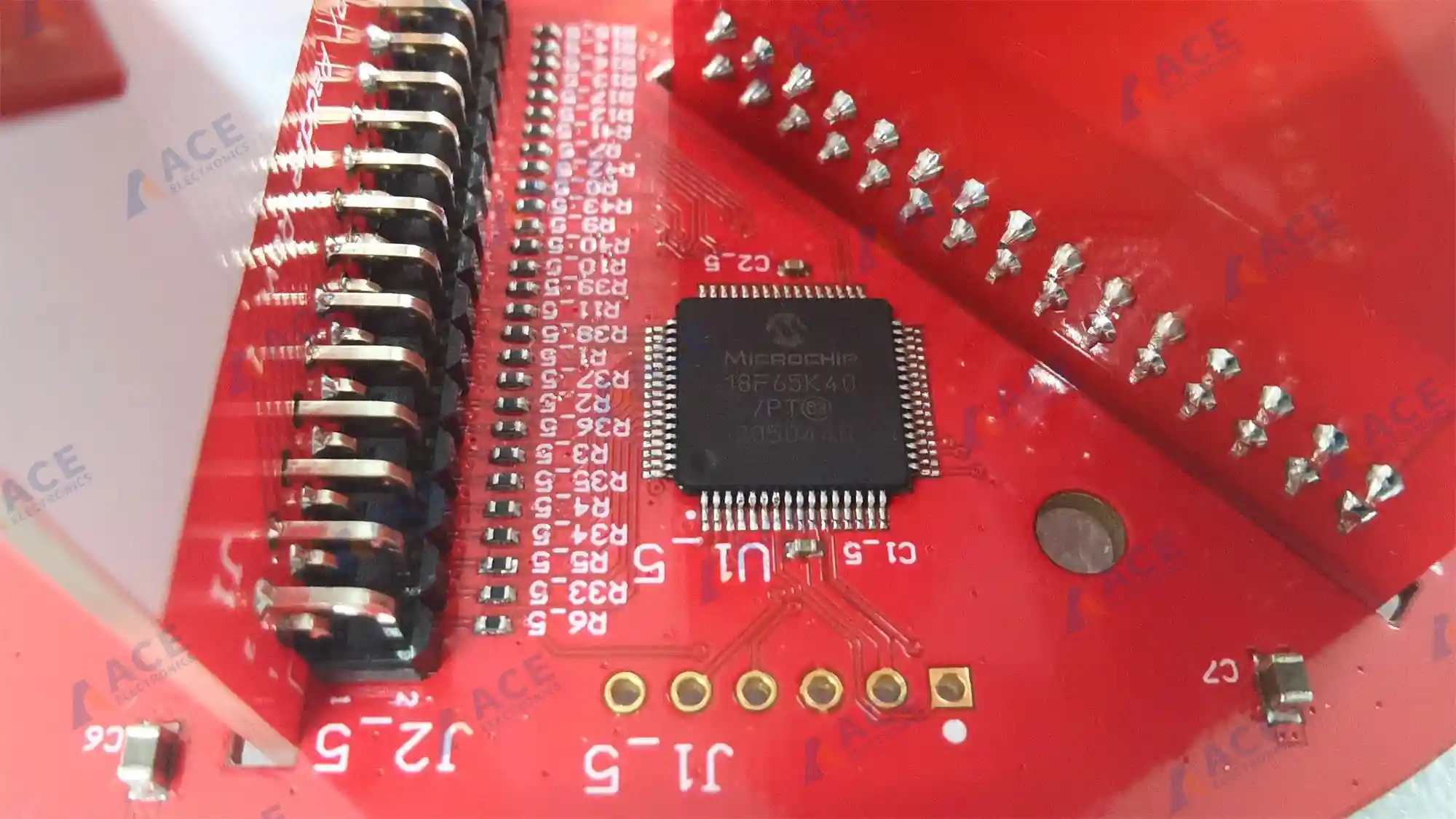 Close-up of Microchip PIC MCU soldered on red agricultural sensor PCBA